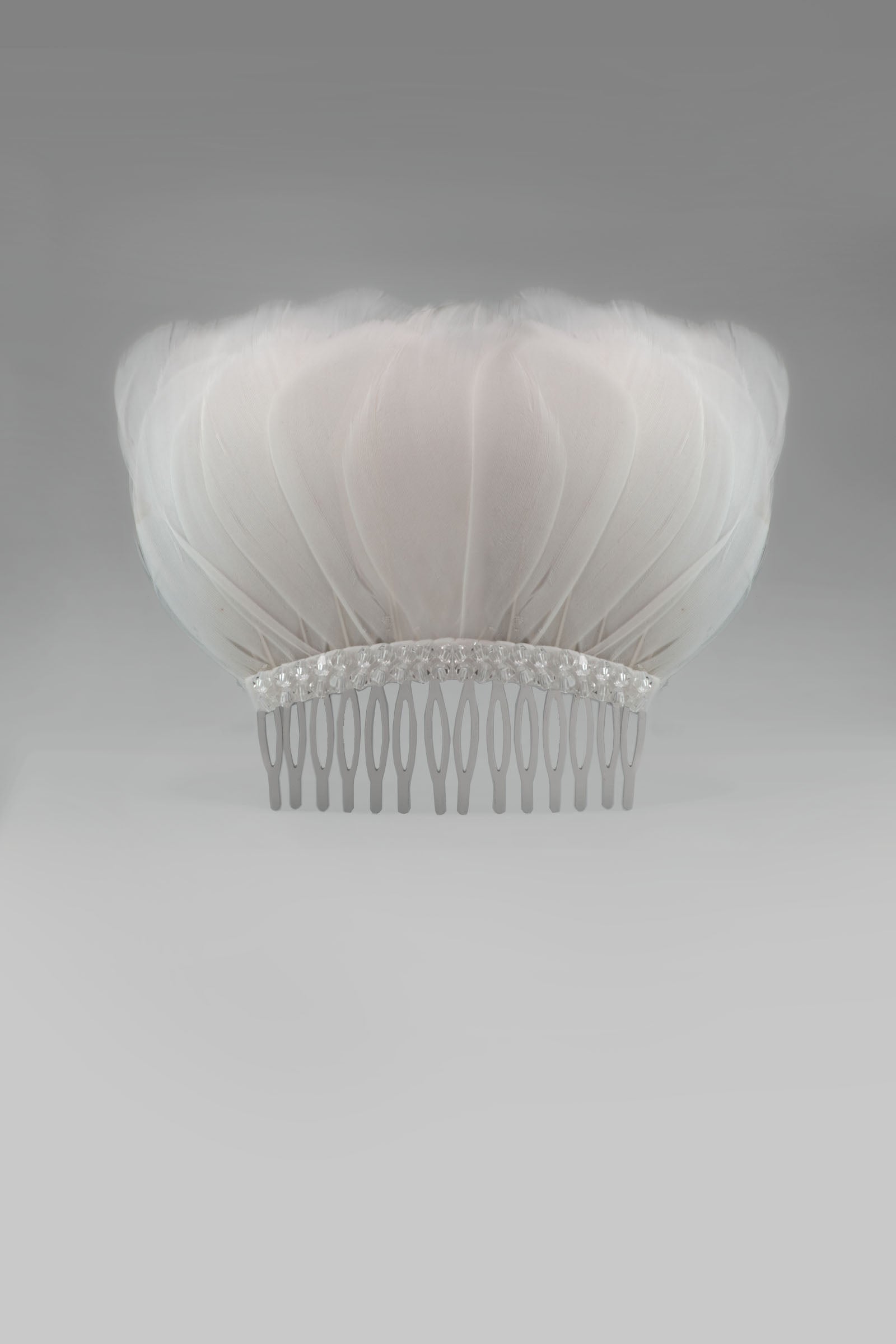 Looking for beautiful wedding hair accessories? Discover Bonito & Grace's stunning collection of bridal hair accessories and wedding day hair accessories. Bring a little sparkle with our feather and crystal wedding hair clip, Bridal hair accessories.